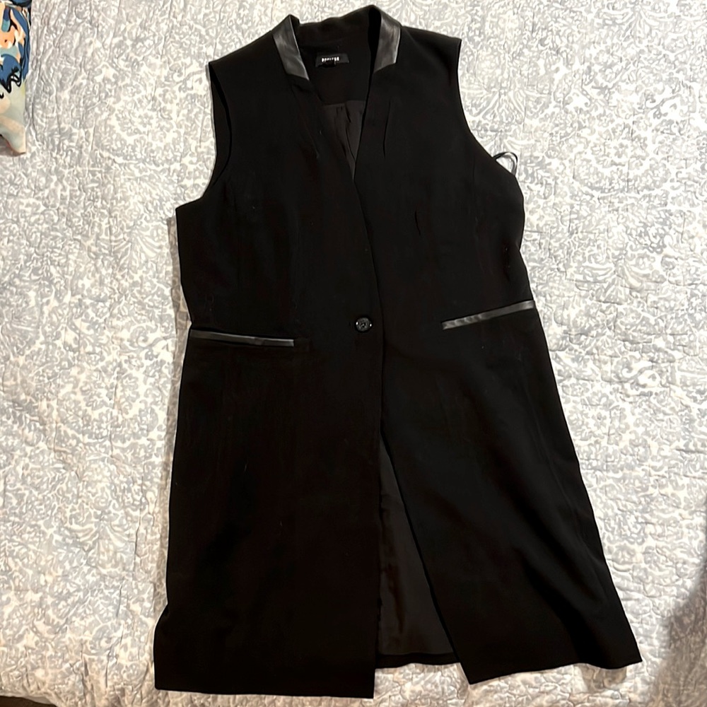 Hip length black vest with leather detail